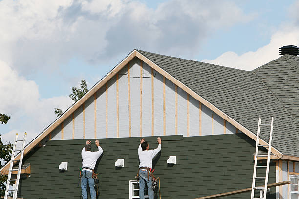 Professional Siding Contractor technician working in Oxford, MD